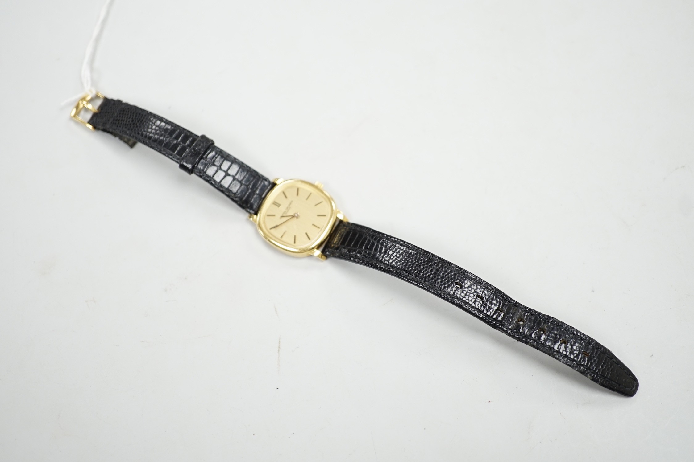 A lady's 18ct gold Vacheron & Constantin, manual wind wrist watch, on associated leather strap with 750 buckle, case diameter 23mm.